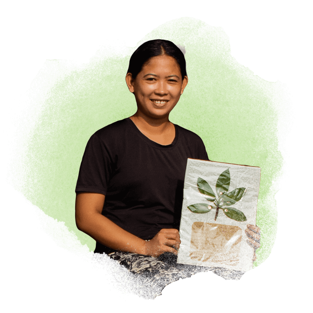 A portrait of Hazel Brum holding her object of memory: a bakhaw (mangrove) stem